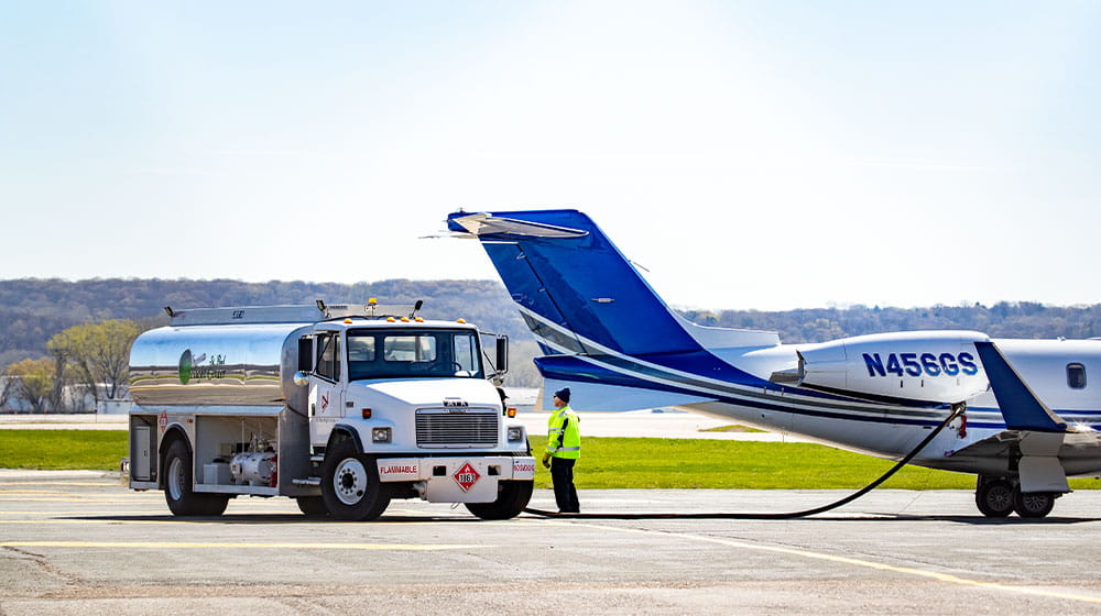 Airplane being refueled from tanker truck